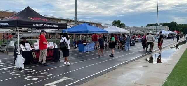 Community booths line the Bayside High School track
